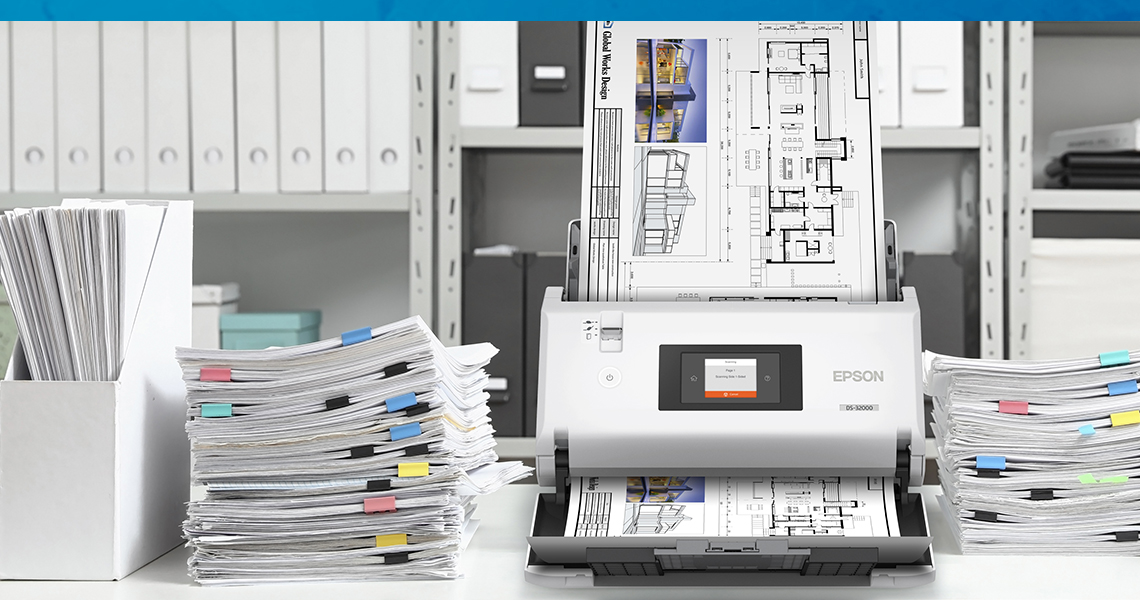 Stacks of paper organized and scanned with an Epson Document Scanner