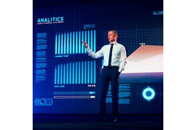 Corporate event speaker with projected image of analytics
