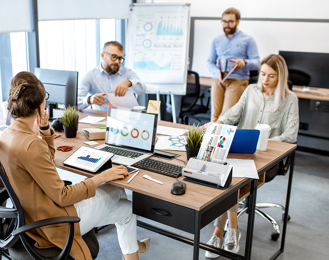 Group of professionals working in office using Epson products