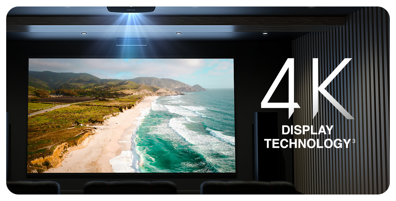 An image projected on a screen in a dark home theater with the text "4K Display Technology (Disclaimer 3)"