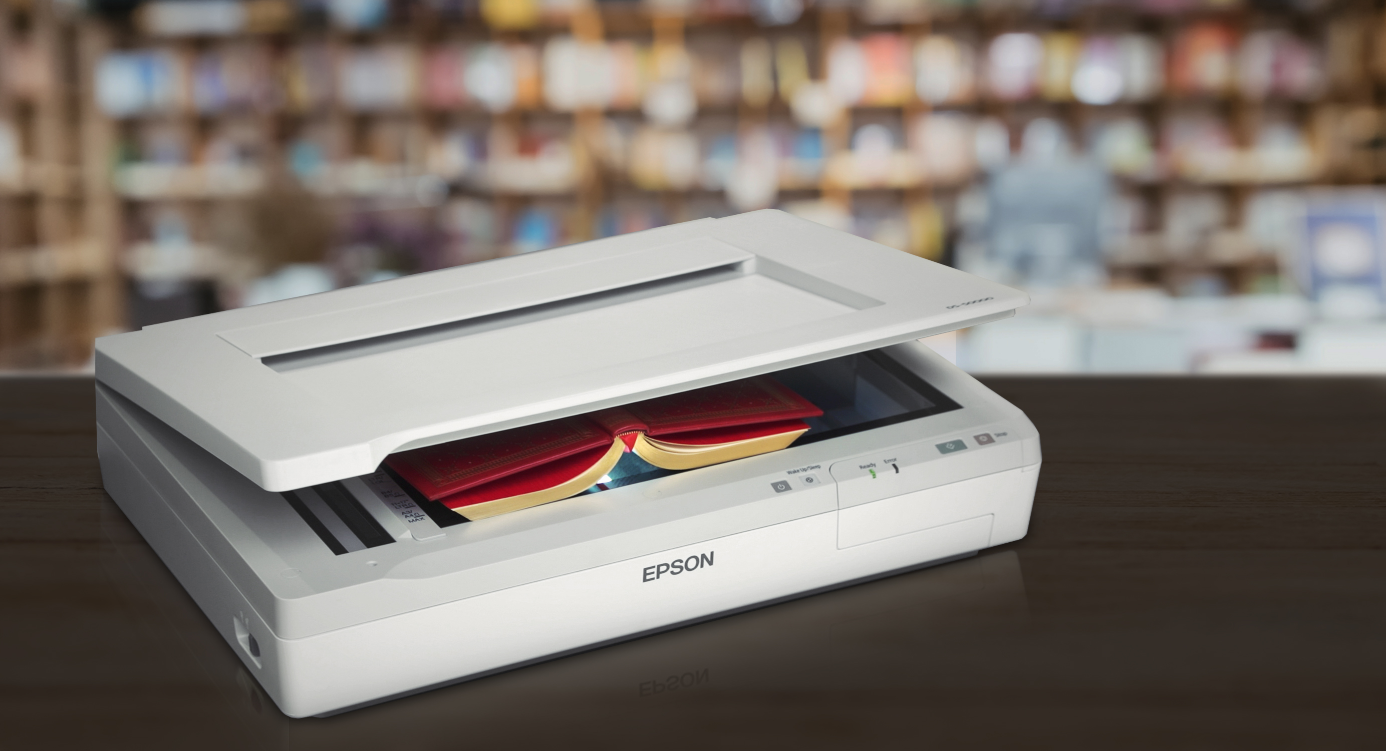 An Epson DS-50000 being used to scan an old book.