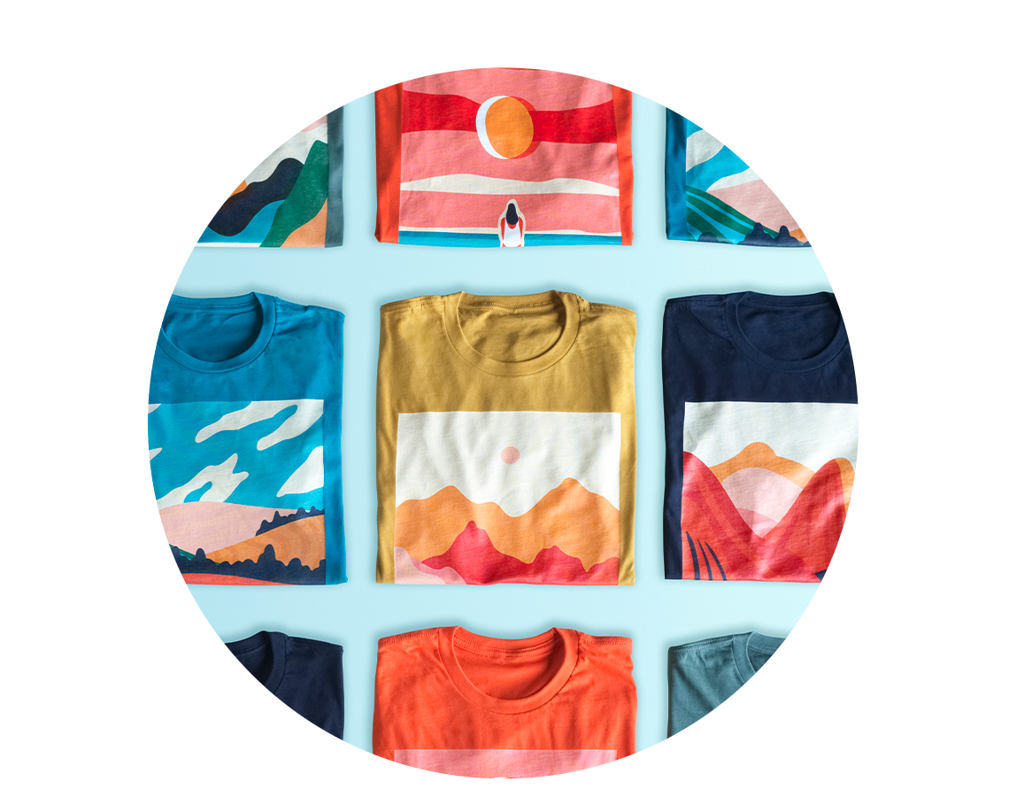 Colorful printed t-shirts arranged in rows