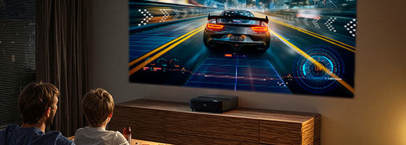 Two people playing a racing game on a projected display
