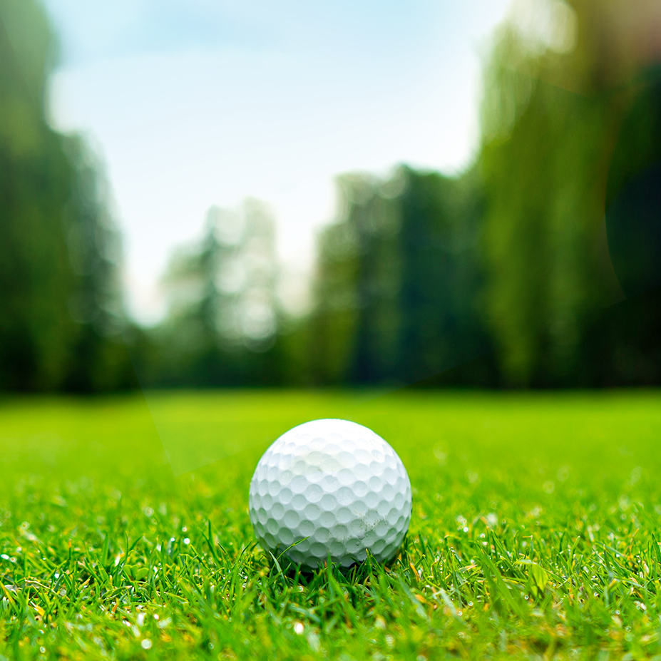 Golf ball on green grass