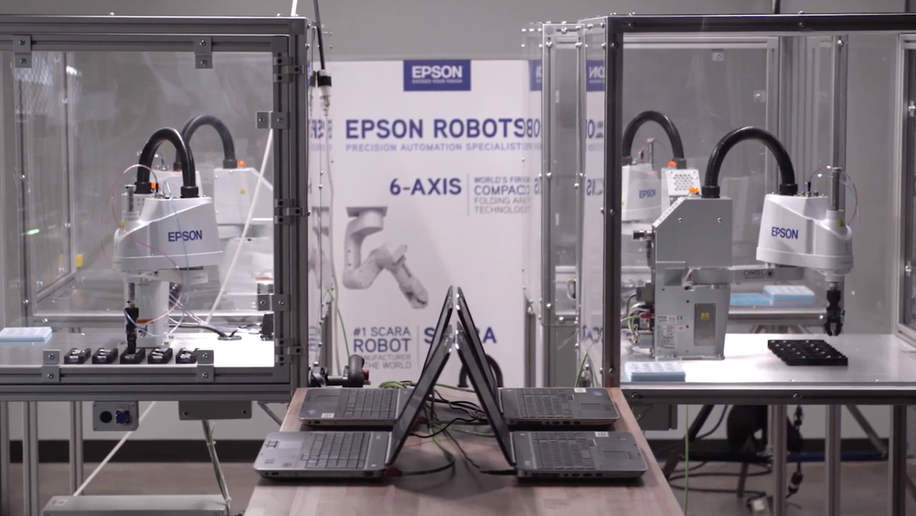 Physical robotics lab with four Epson robots