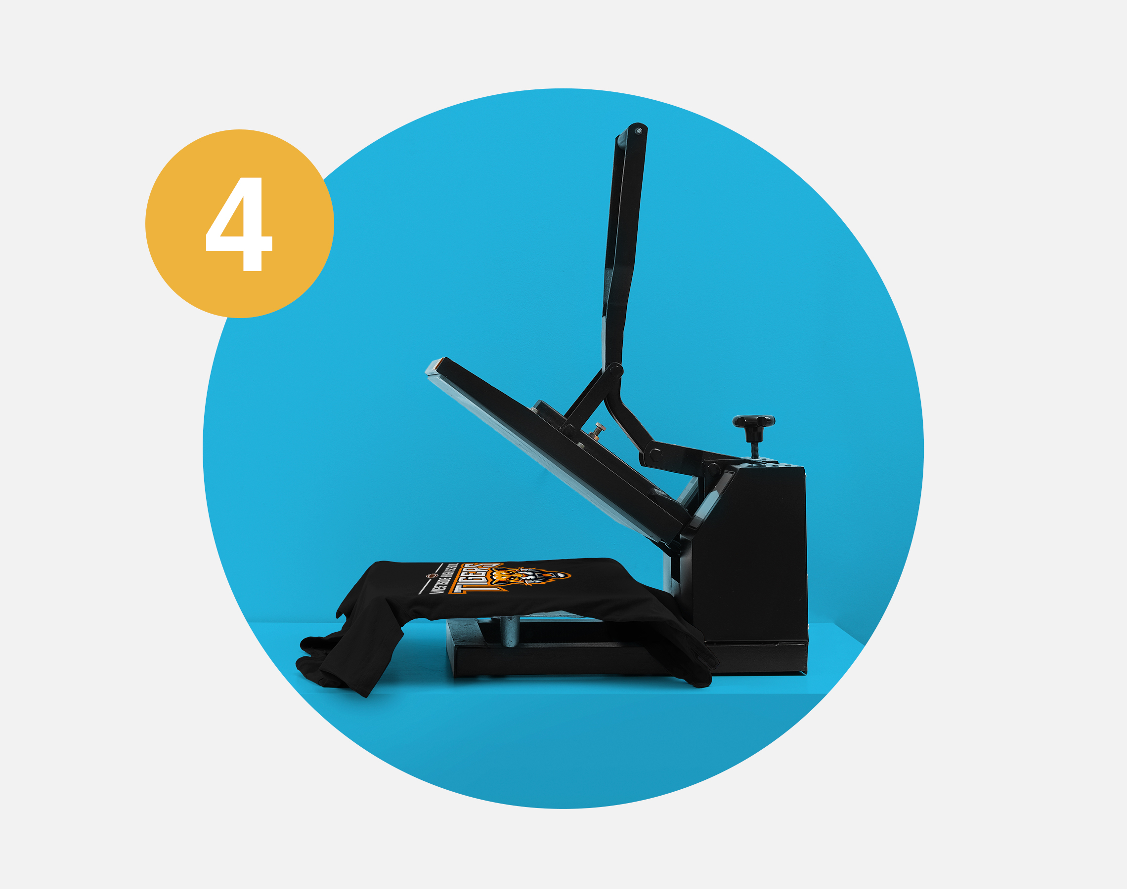 T-shirt printed with tiger mascot logo, on heat press.