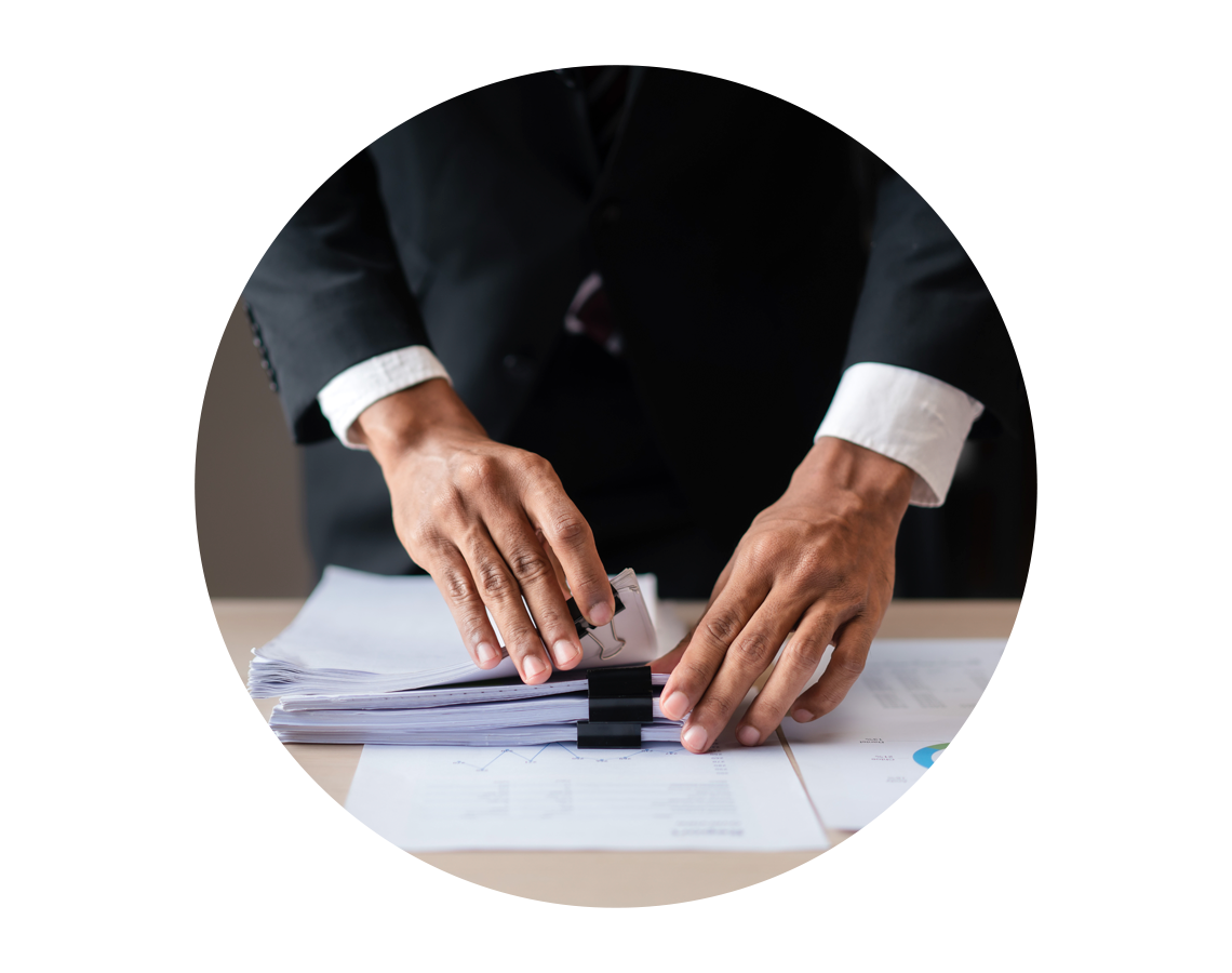 Office worker clipping papers together