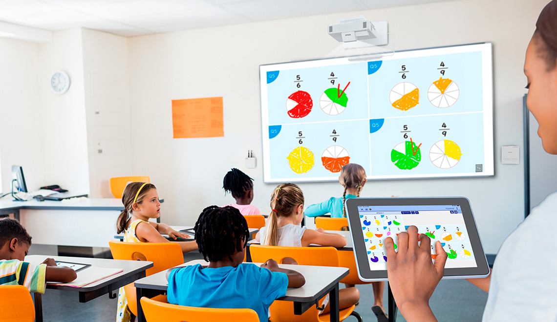 Teacher in classroom projecting  tablet screen
