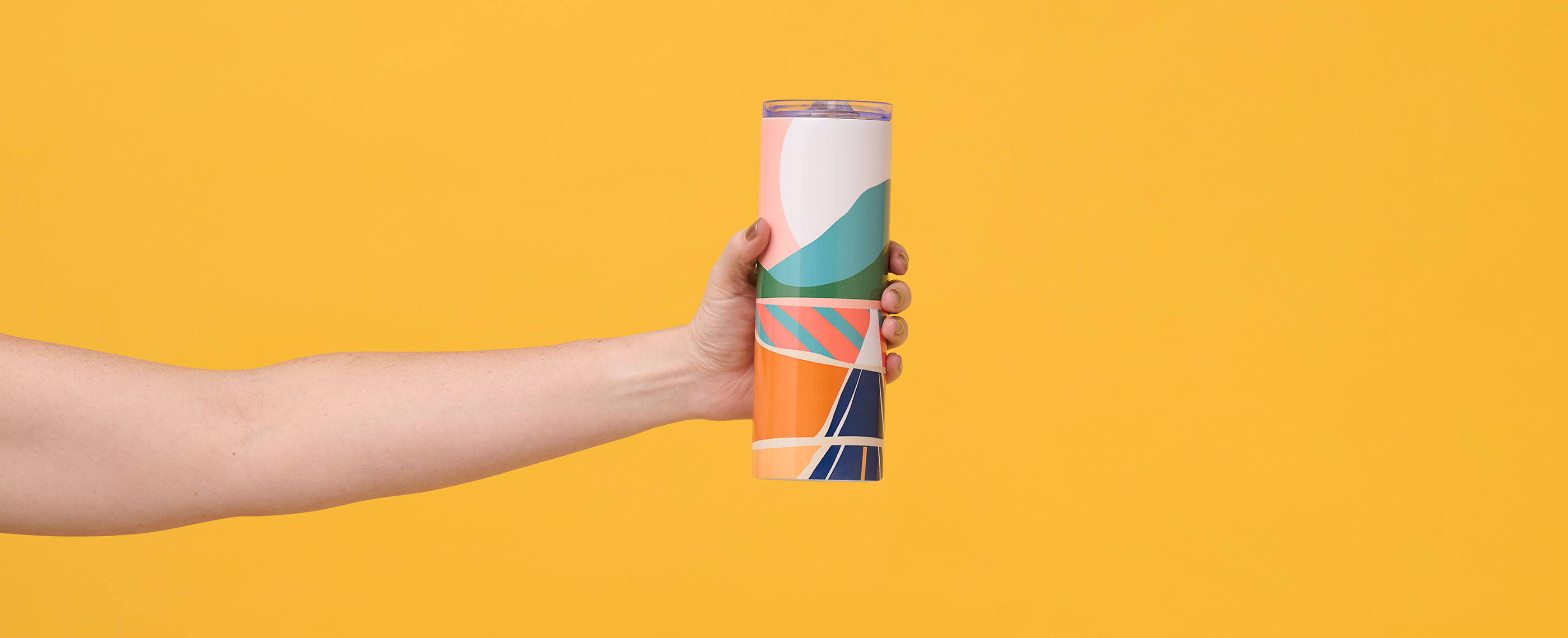 Tumbler printed with sunset landscape illustration.