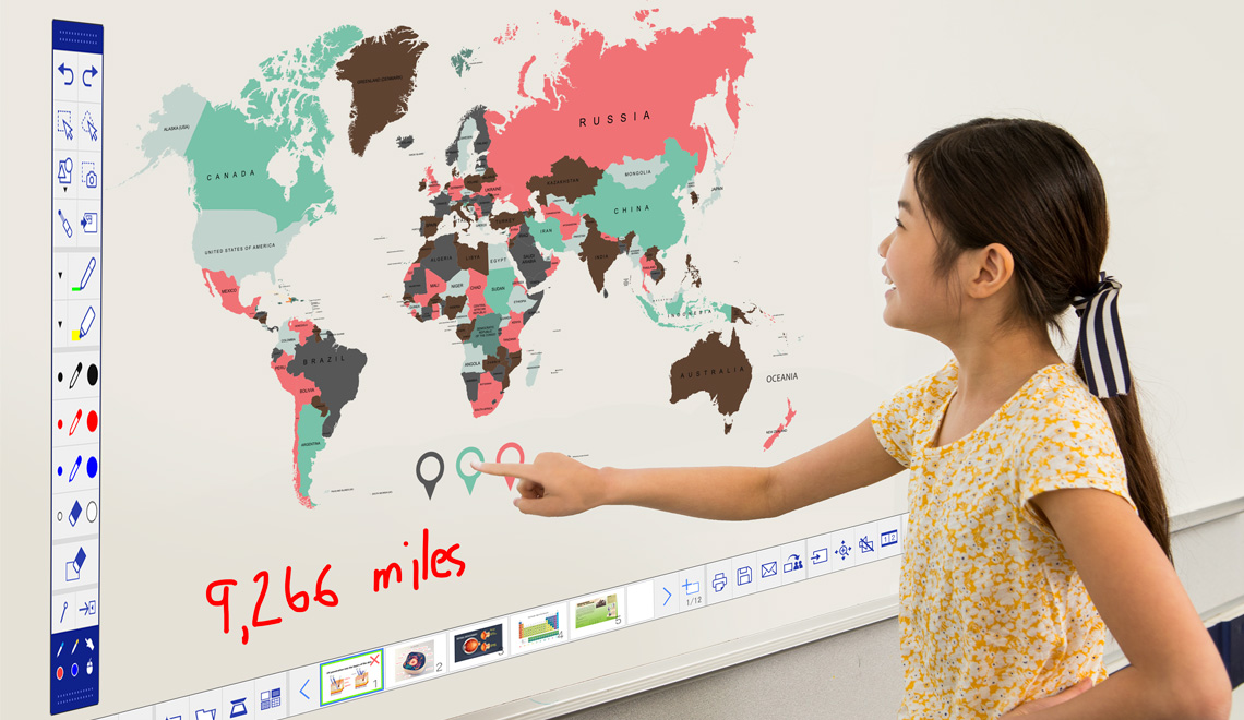 A student interacting with a projected image on a whiteboard