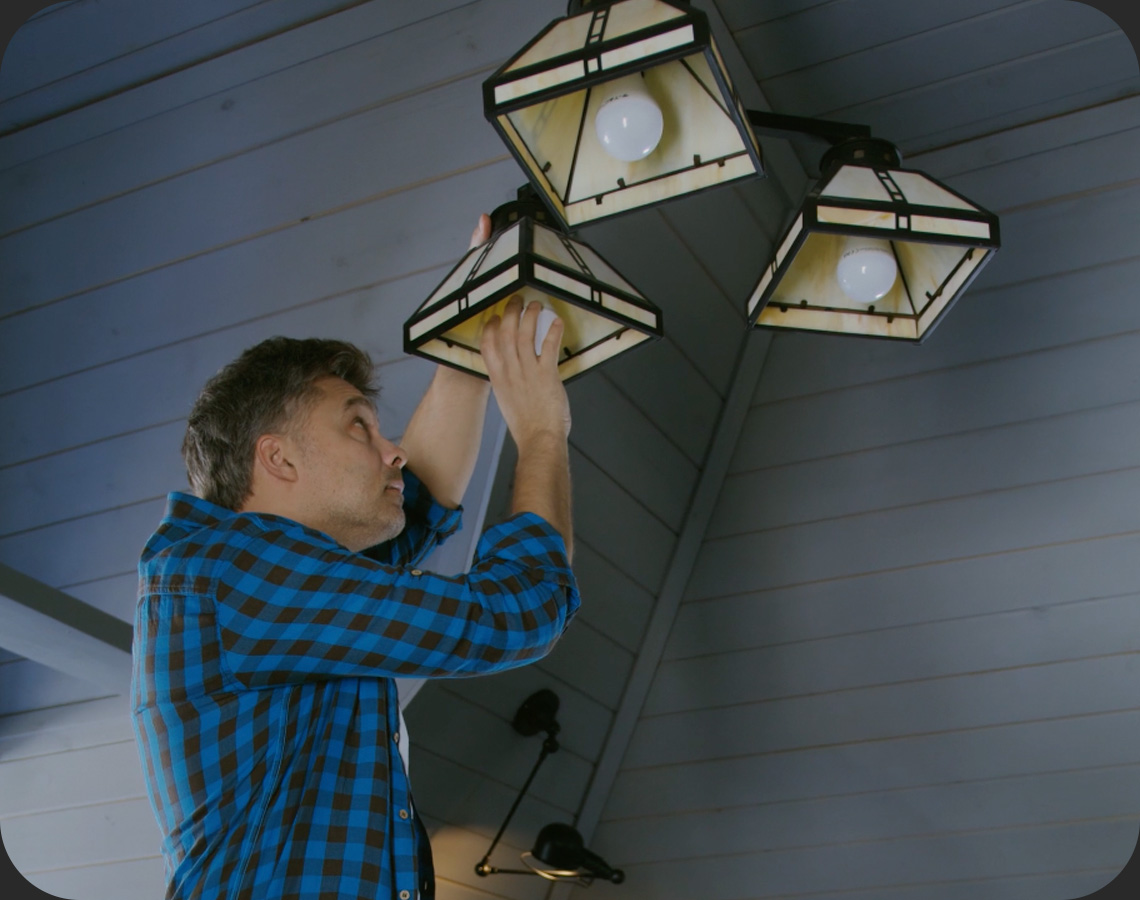 Man fixing light fixture