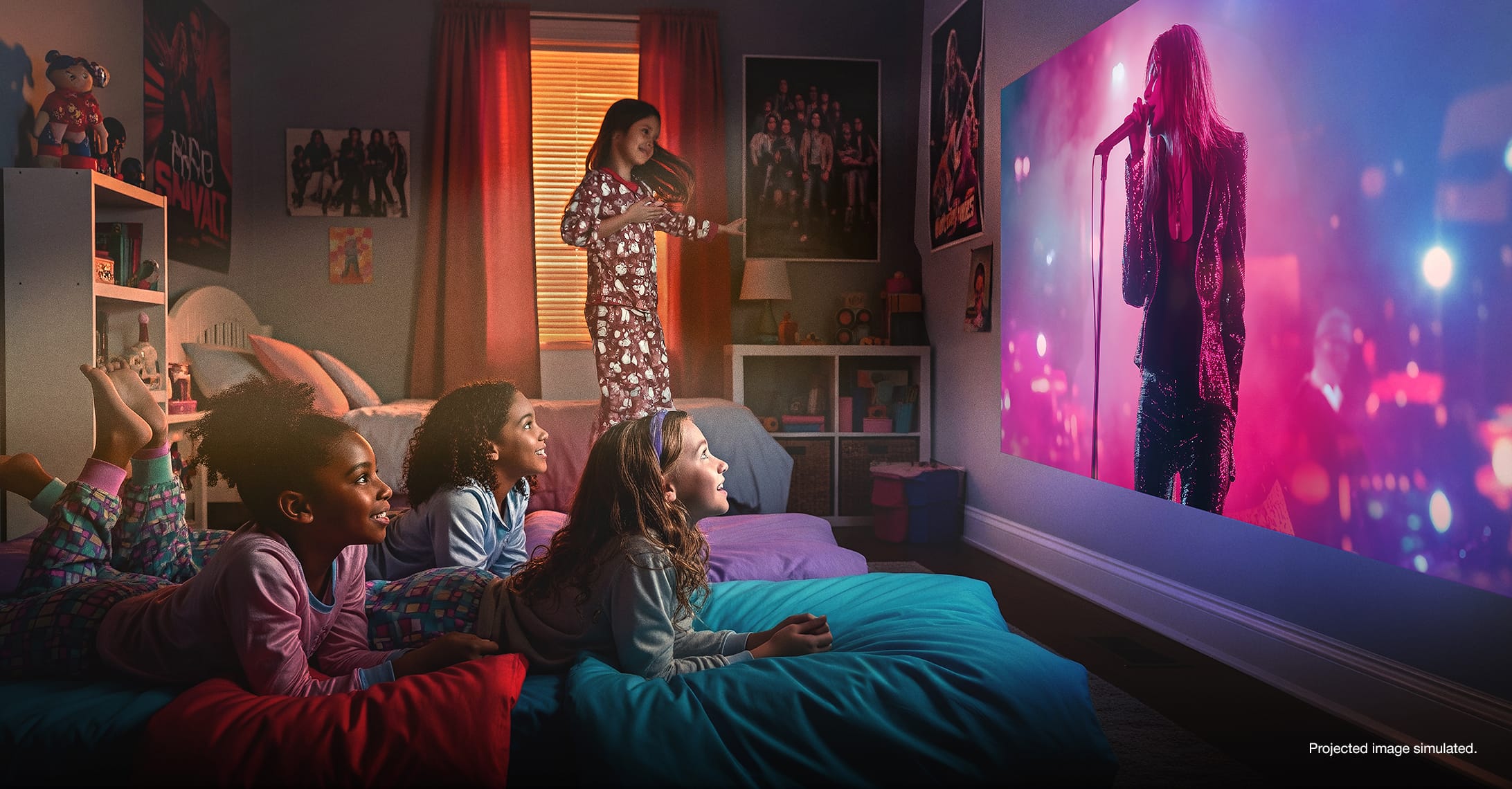 Children in a bedroom watching a concert on a projected display

