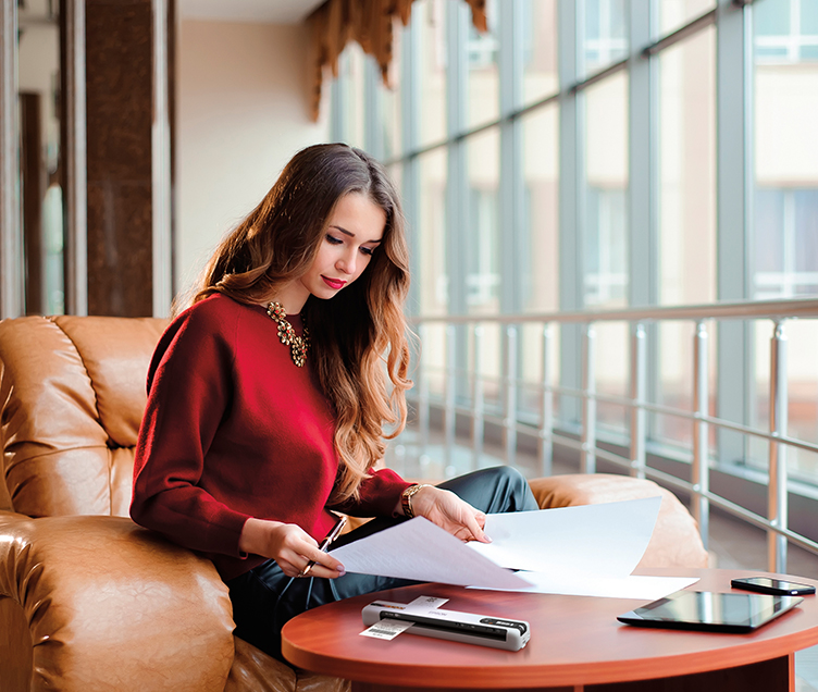 Customer using an Epson WorkForce DS-80W Wireless Portable Document Scanner