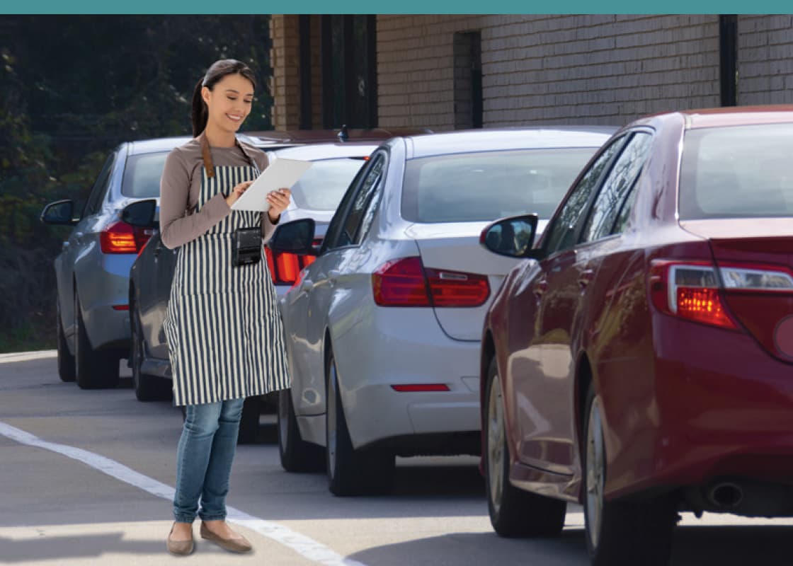 A server reviews a curbside order