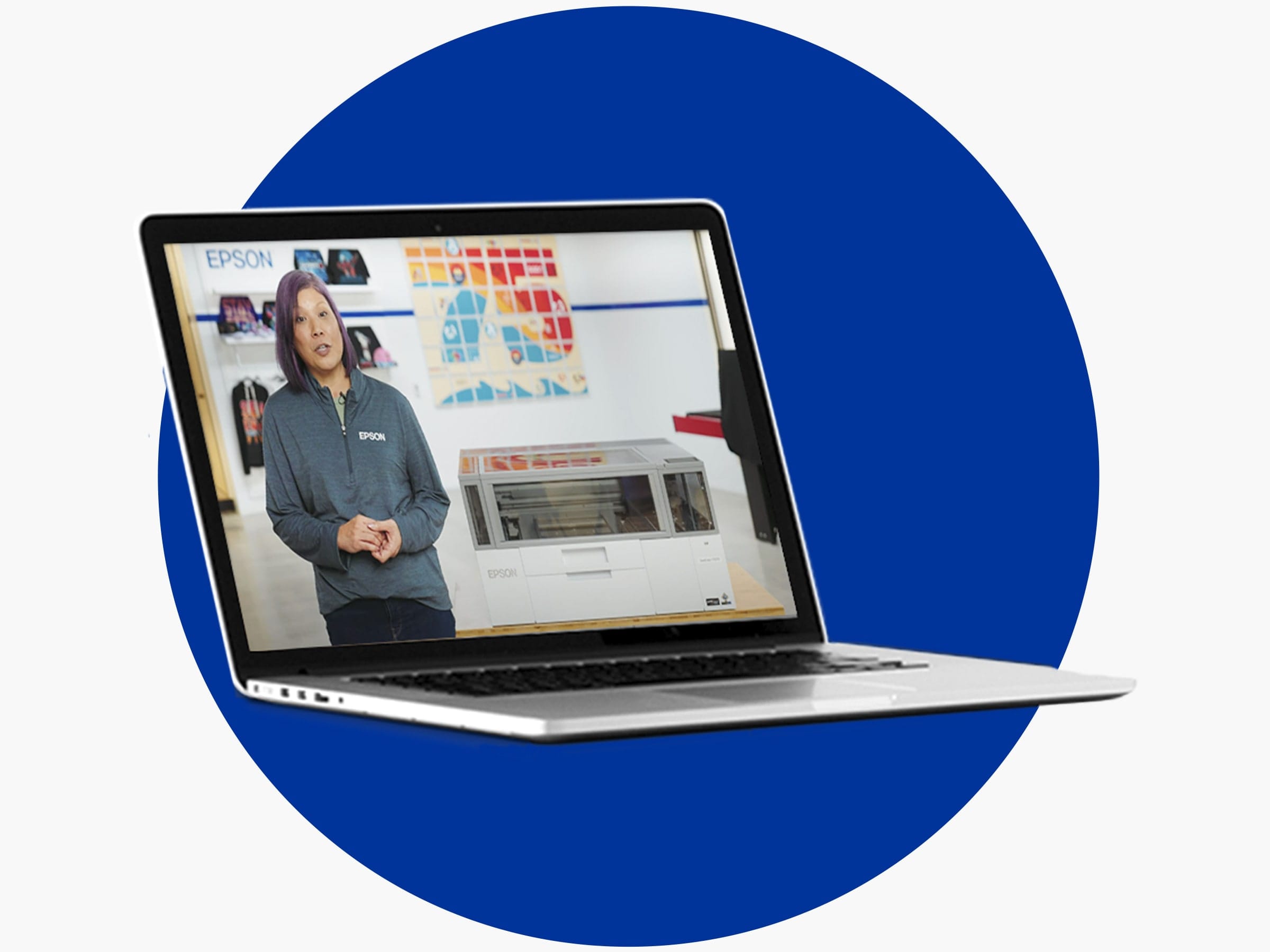 A laptop displaying an Epson Print Academy video