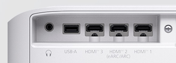 Close up view of the 3.5mm audio jack, USB-A, HDMI, and HDMI eARC/ARC ports on the back of a Lifestudio Grand projector

