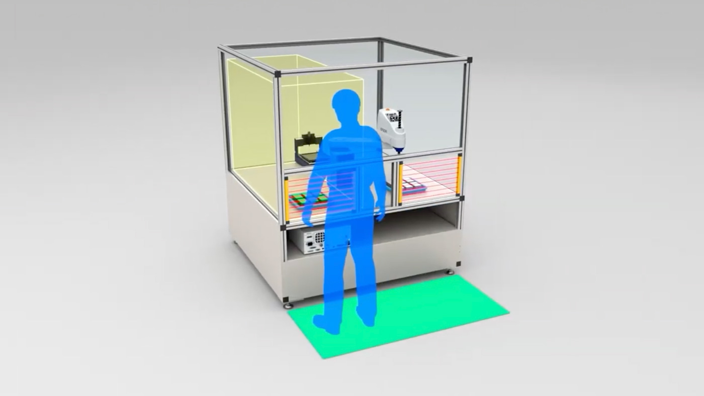 Illustration of a man standing safely in front of a working Epson robot.