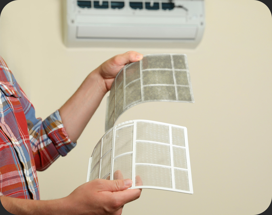 Person holding air conditioning filters