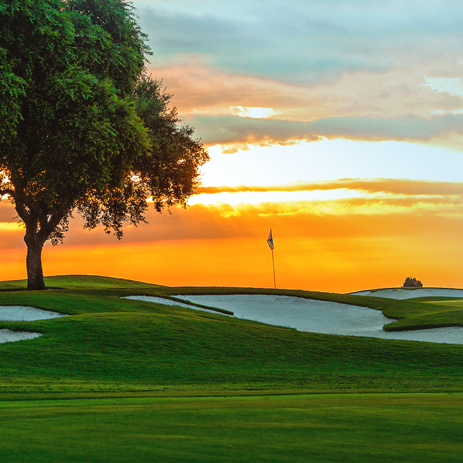 A sunset on a golf course.